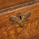 Antique English oak secretary with drop-down front.