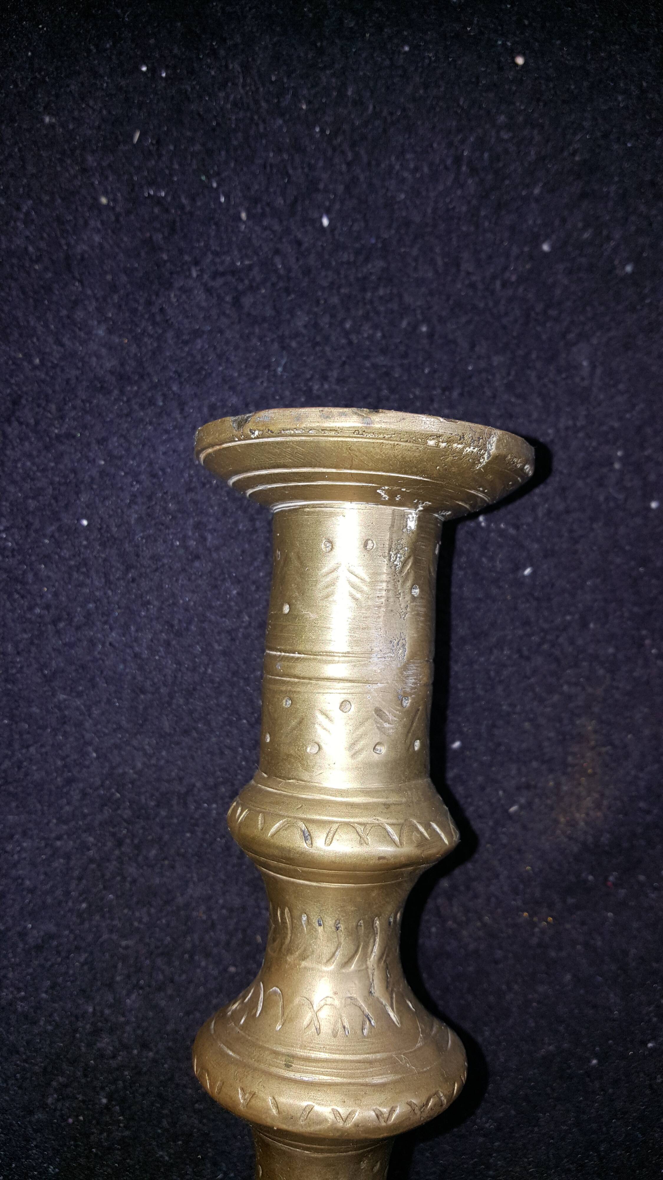 Former pair of bronze candlesticks