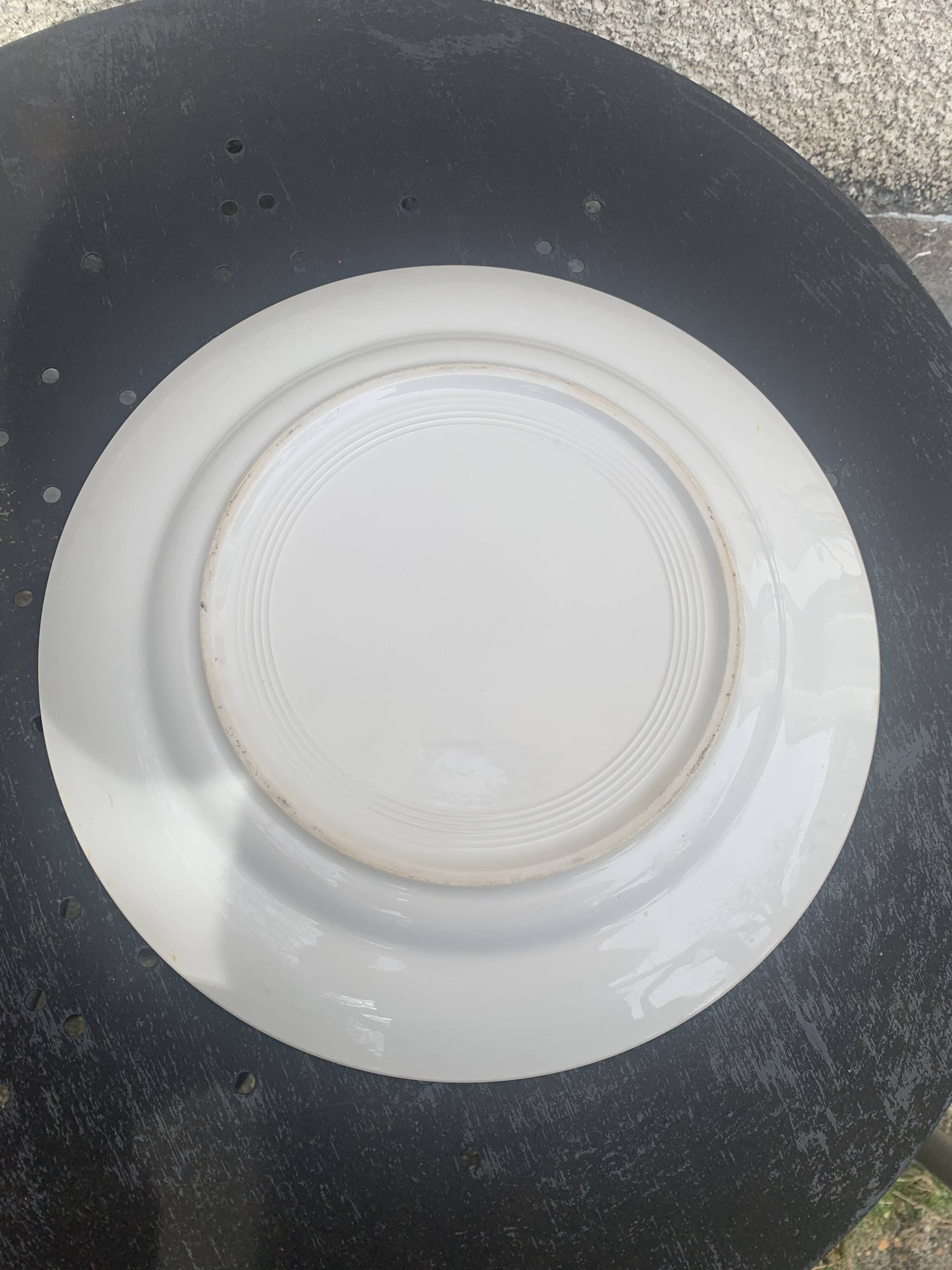 Two earthenware dishes, one hollow and one white cake dish with yellow border