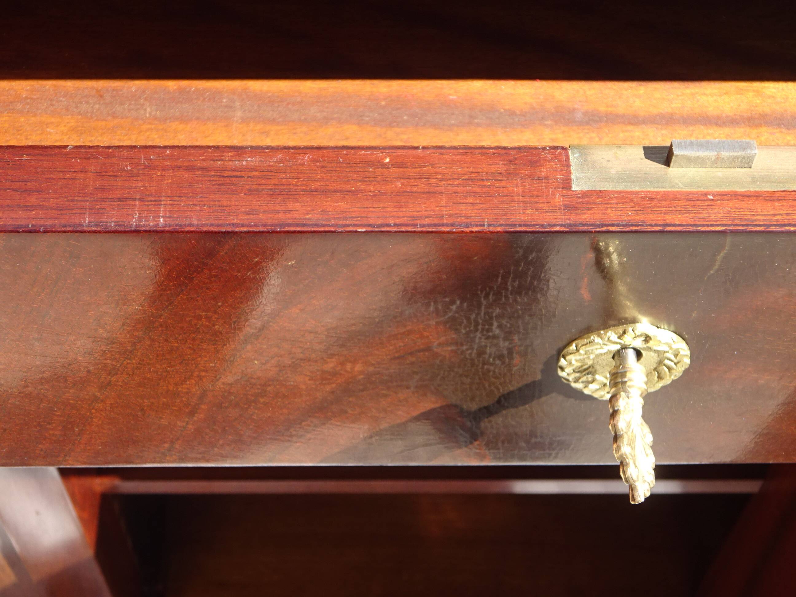 Flamed mahogany enfilade with sea green marble in Empire style.