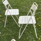 Set of 9 vintage perforated metal folding chairs from the 1970s-80s.