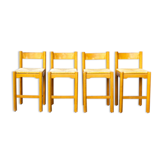 Four wooden and straw stools 70