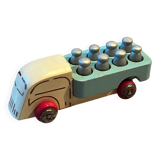 Small wooden milk truck with its cans, antique toy