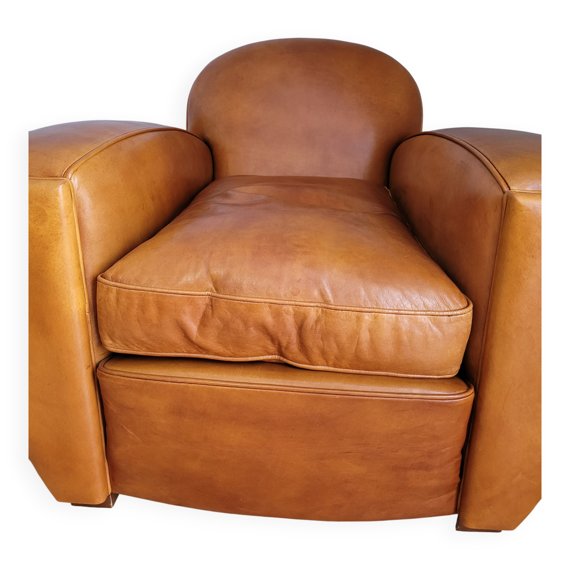 Leather club armchair and its pouf