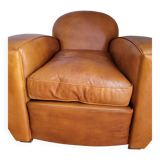 Leather club armchair and its pouf