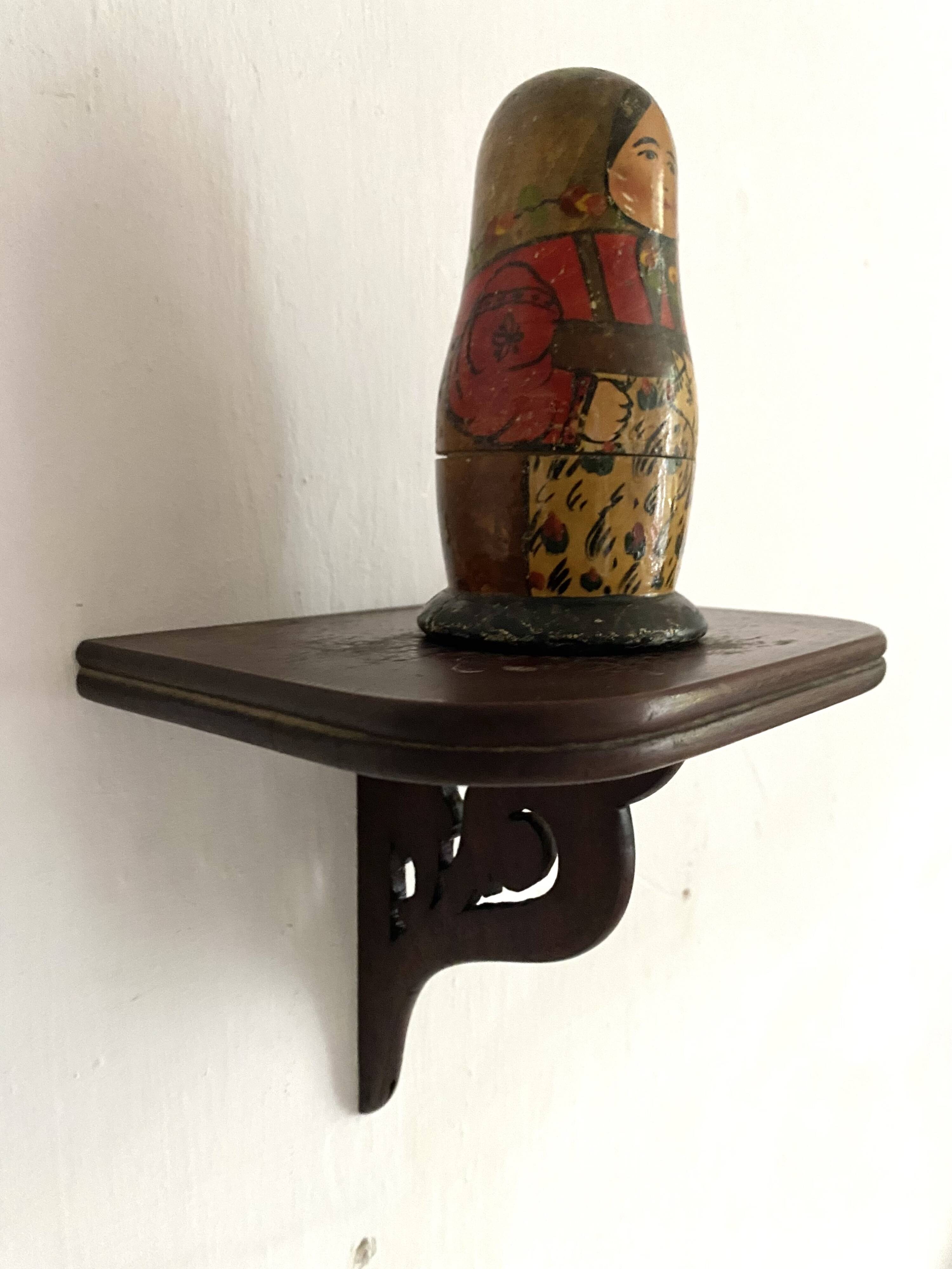 small old openwork wooden wall shelf