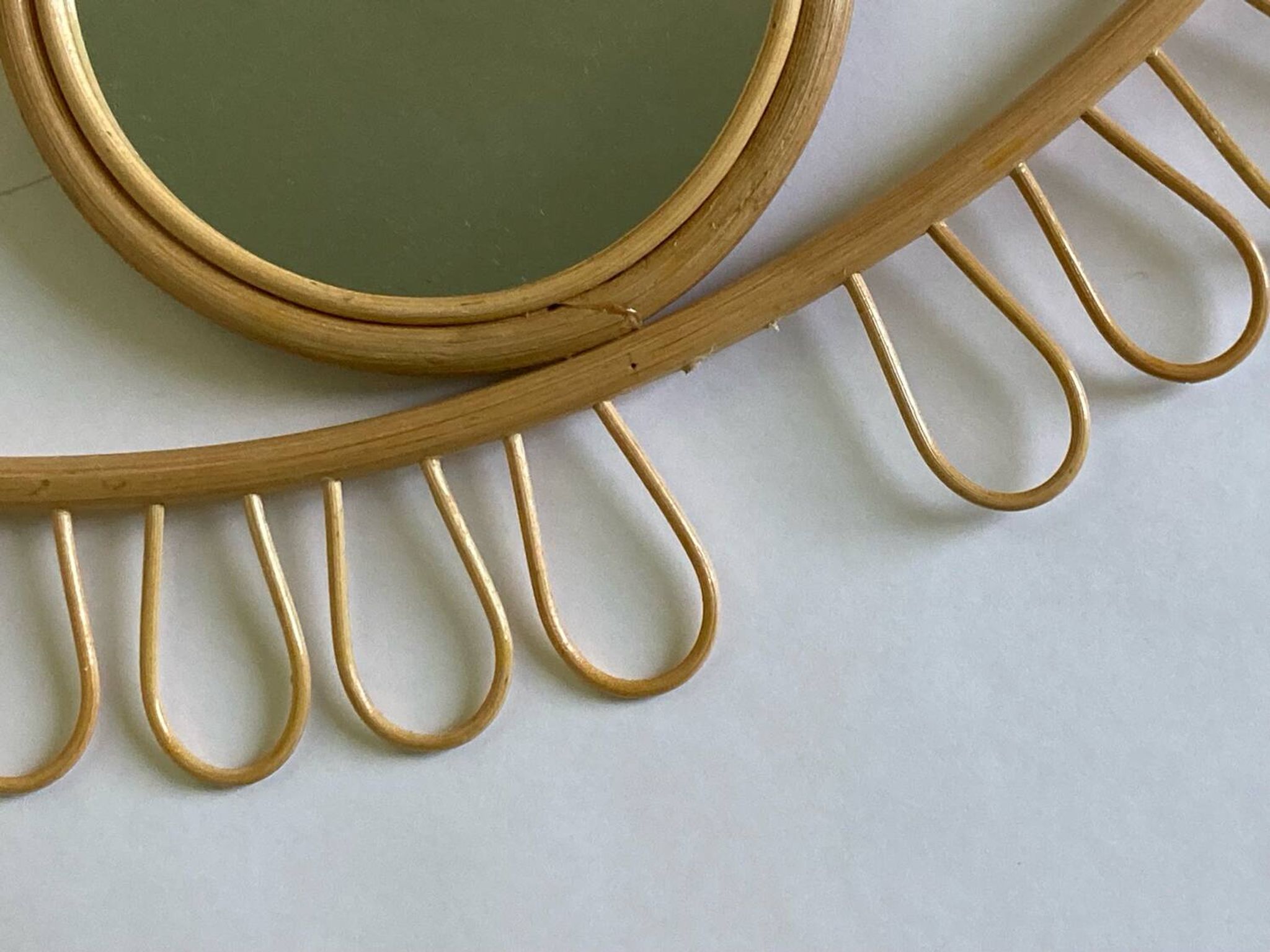 Rattan eye mirror