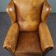 Antique armchair in patinated sheepskin