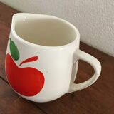 Vintage pitcher with apple decoration.