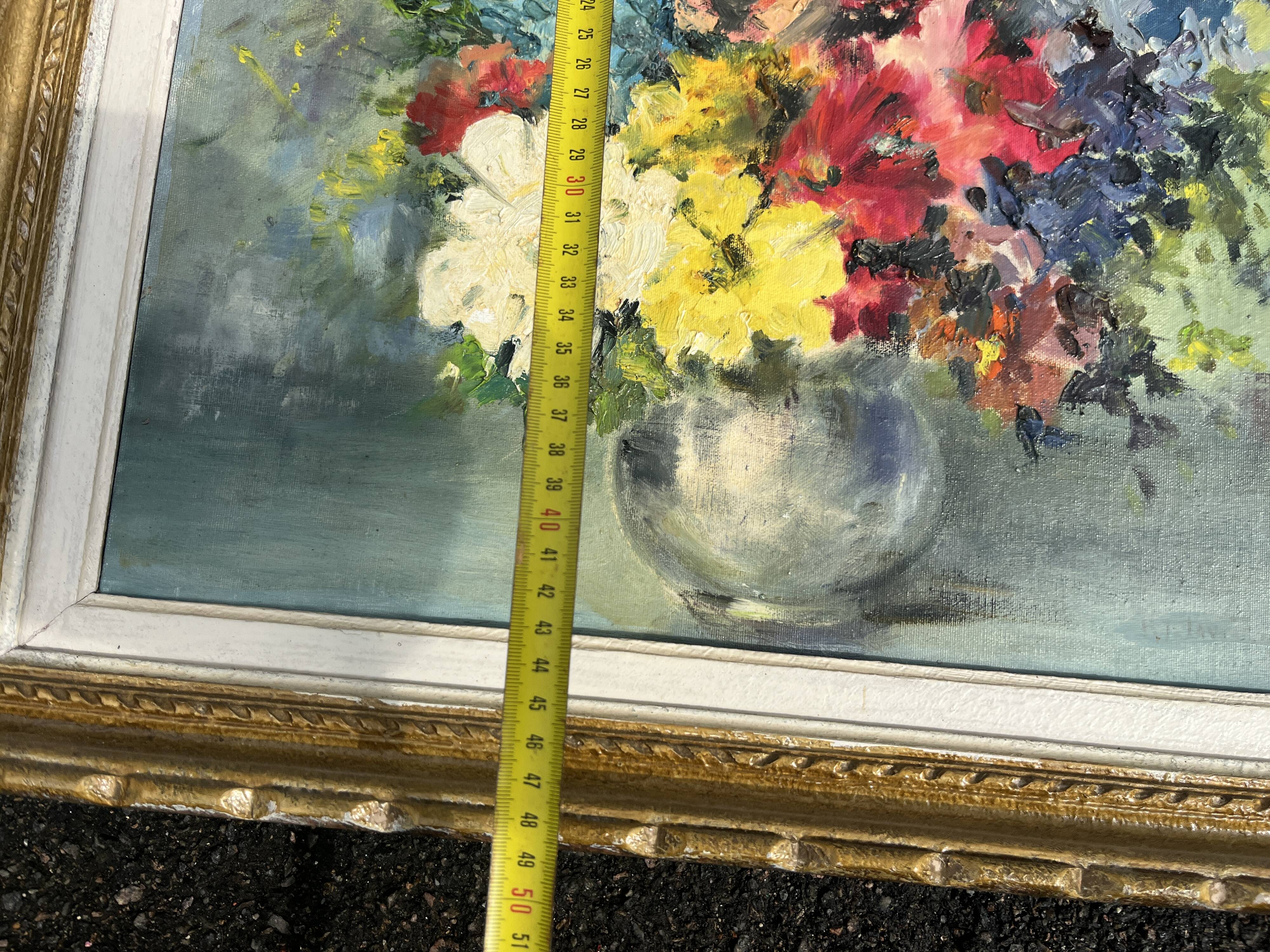 Still life of flowers in Impressionist style with a golden frame.