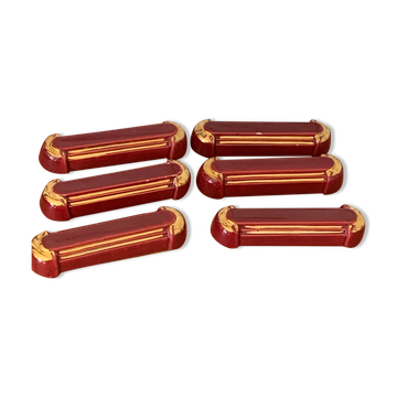 6 porte-couteaux en céramique émaillée bordeaux et liseré or art deco