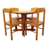 Suite of a round table with extension and 4 vintage pine chairs from the 60s and 70s