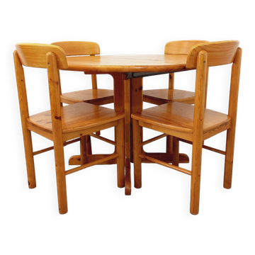 Suite of a round table with extension and 4 vintage pine chairs from the 60s and 70s