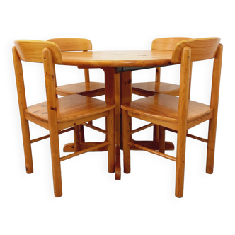 Suite of a round table with extension and 4 vintage pine chairs from the 60s and 70s