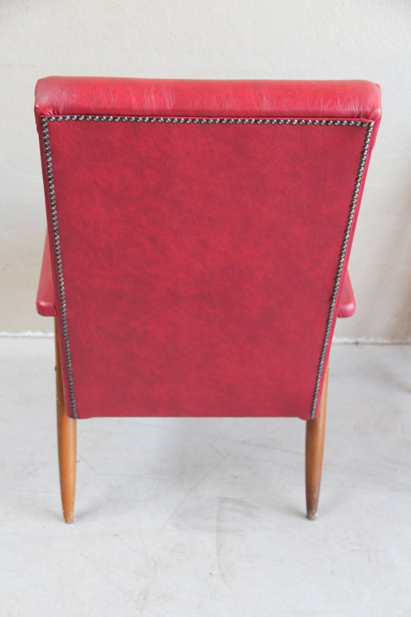 Vintage armchair in red leatherette