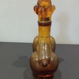 Flacon ancien en verre ambré "caniche"