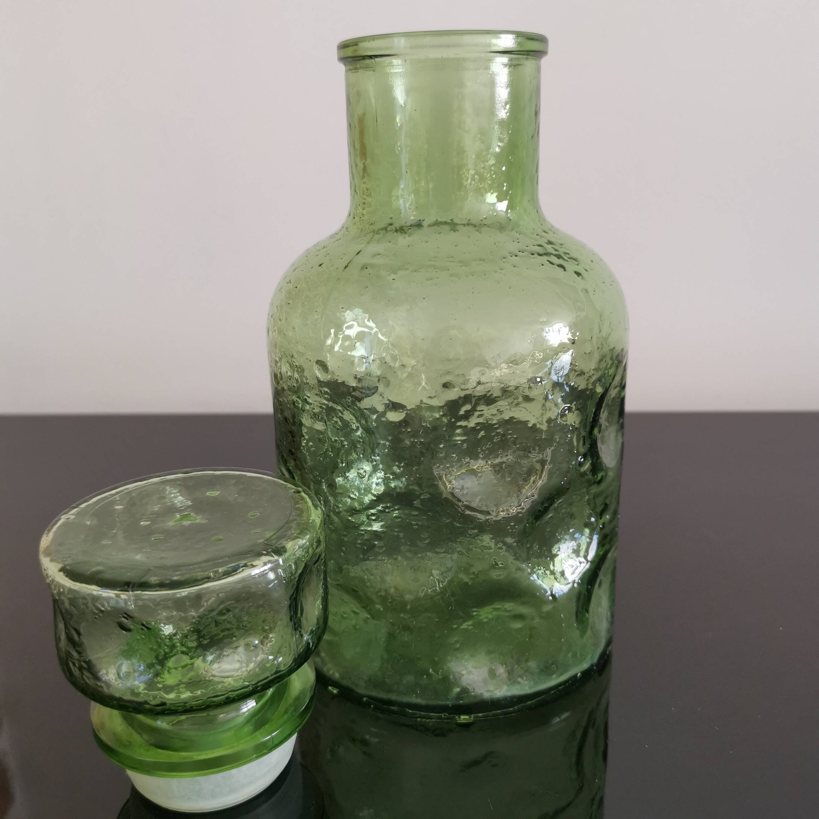 Old green glass carafe