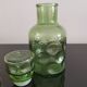 Old green glass carafe