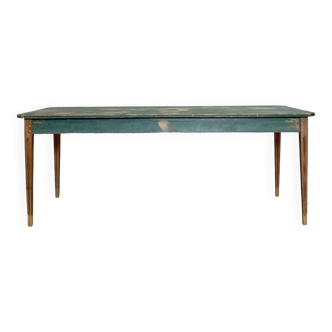 Vintage farm table with spindle legs.