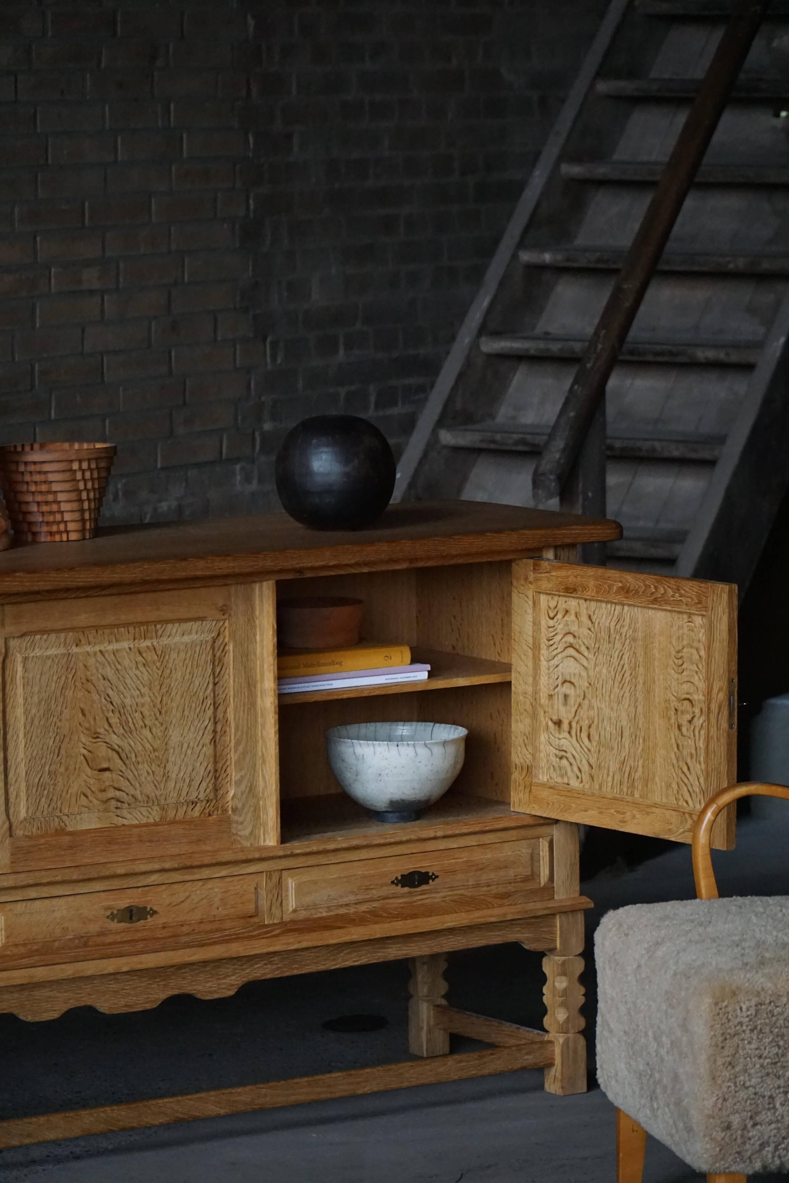 Brutalist Danish enfilade from the mid-century in oak by Henning Kjærnulf, 1960s.