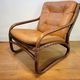 Vintage rattan armchair with leather cushions from 1970