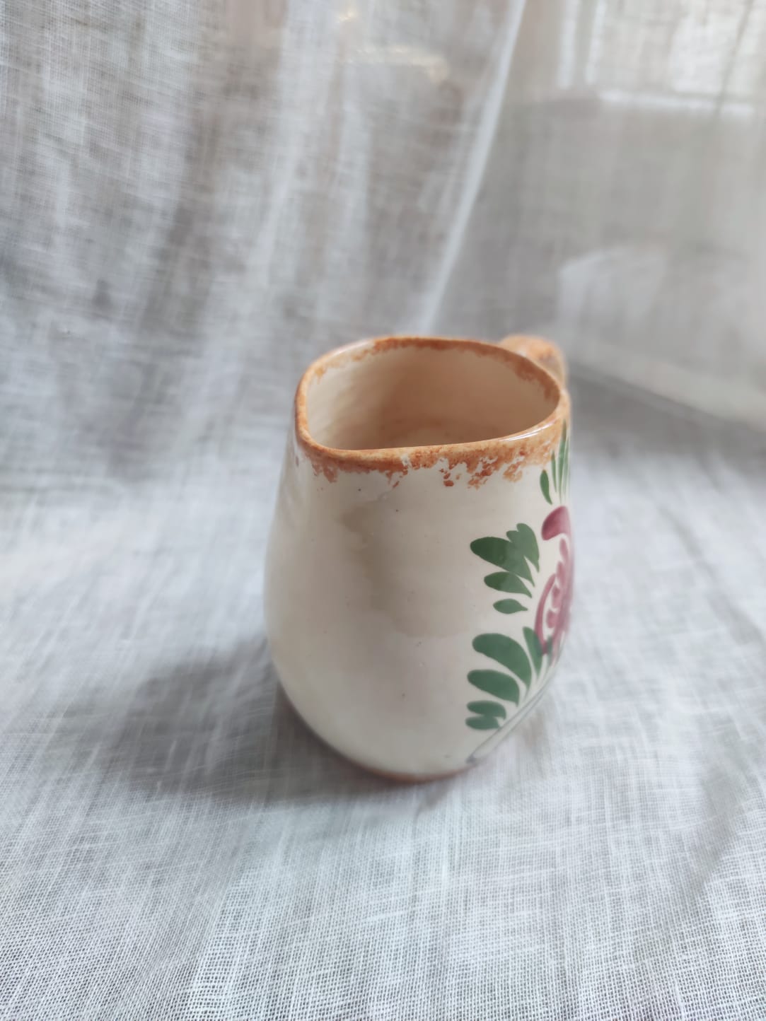 Small hand-painted pitcher