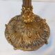 Old golden brass towel rack on baroque style foot