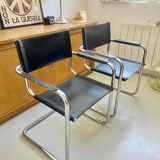 Pair of vintage chrome and black faux leather armchairs