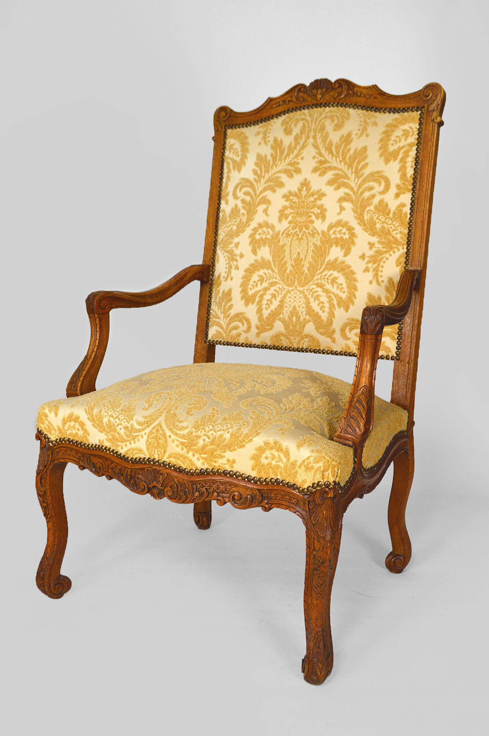 Set of 2 armchairs in carved oak, Louis XV style