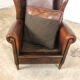 Dark brown sheep leather wingback armchair