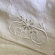 Old embroidered CA monogram sheet