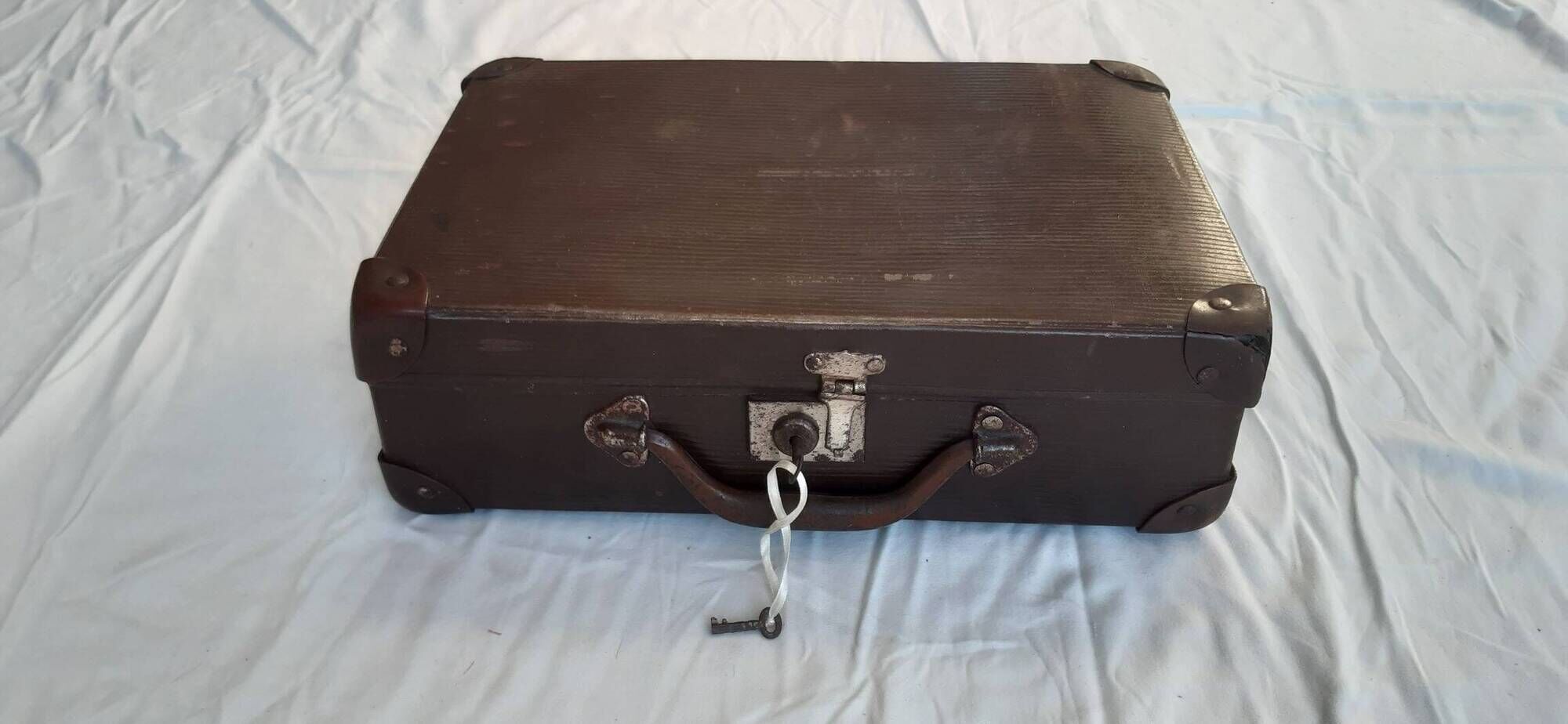 Small old suitcase with a ribbed appearance