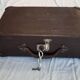 Small old suitcase with a ribbed appearance