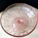 Footed bowl, pressed glass compote in pink Art Deco style.