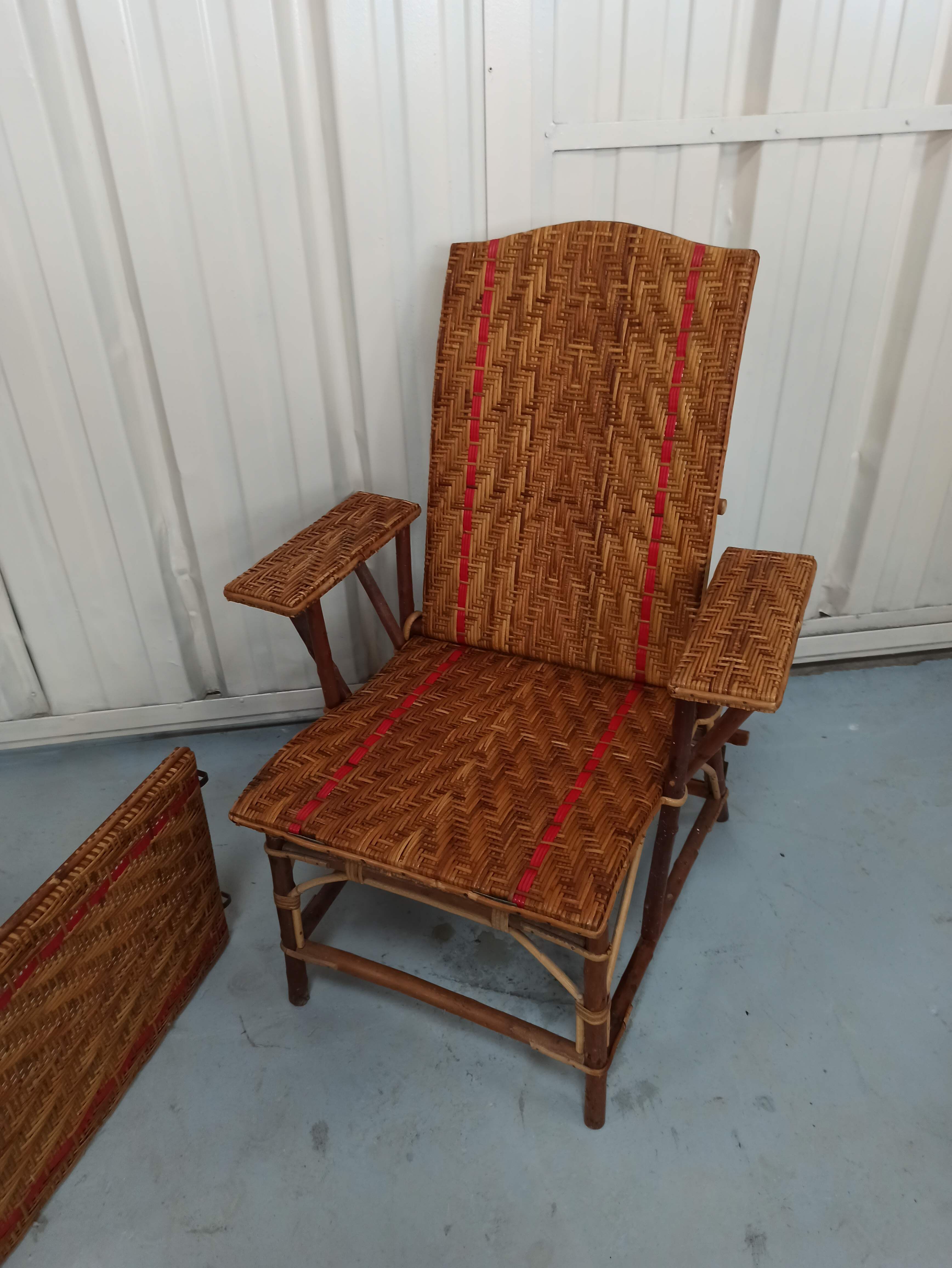 Sunbathing sunbathing in wicker rattan wood deckchair red lounger