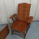 Sunbathing sunbathing in wicker rattan wood deckchair red lounger