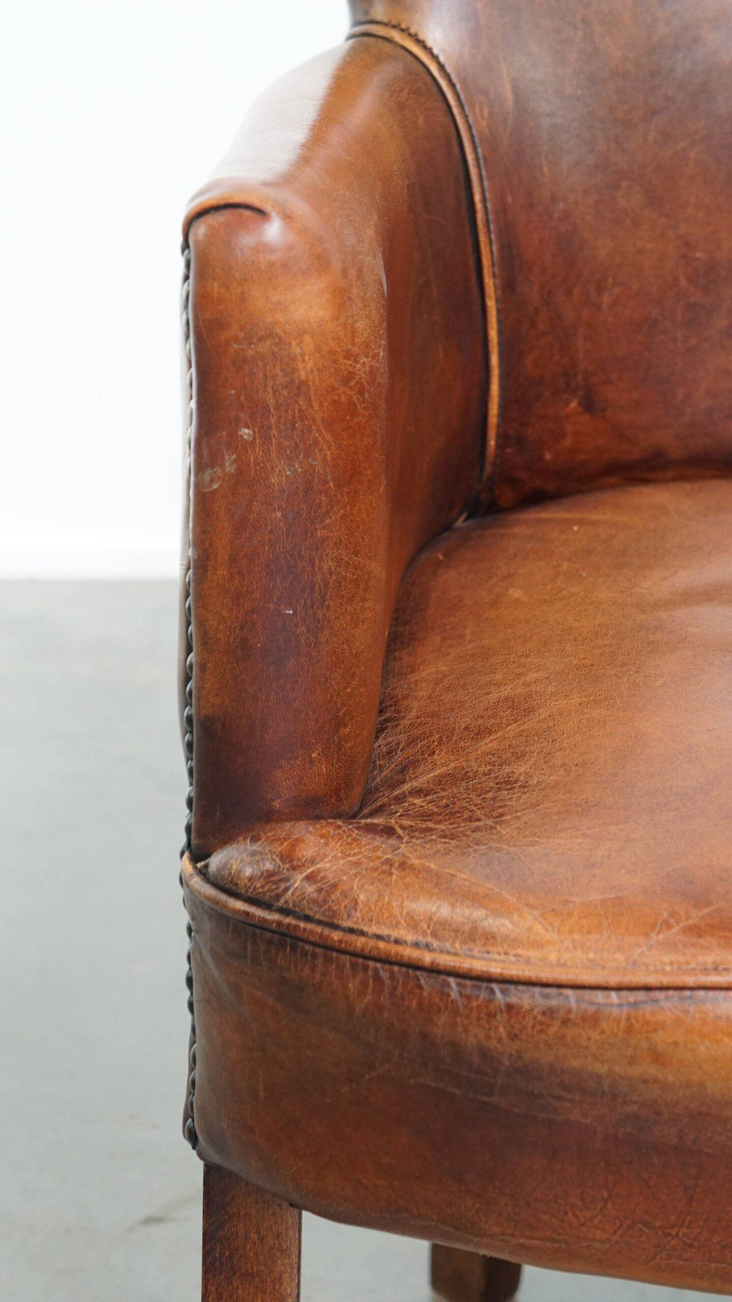 Amazing cognac-coloured sheepskin dining/side chair with armrests
