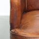 Amazing cognac-coloured sheepskin dining/side chair with armrests