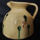 Vintage glazed terracotta ceramic jug from the 20th century.