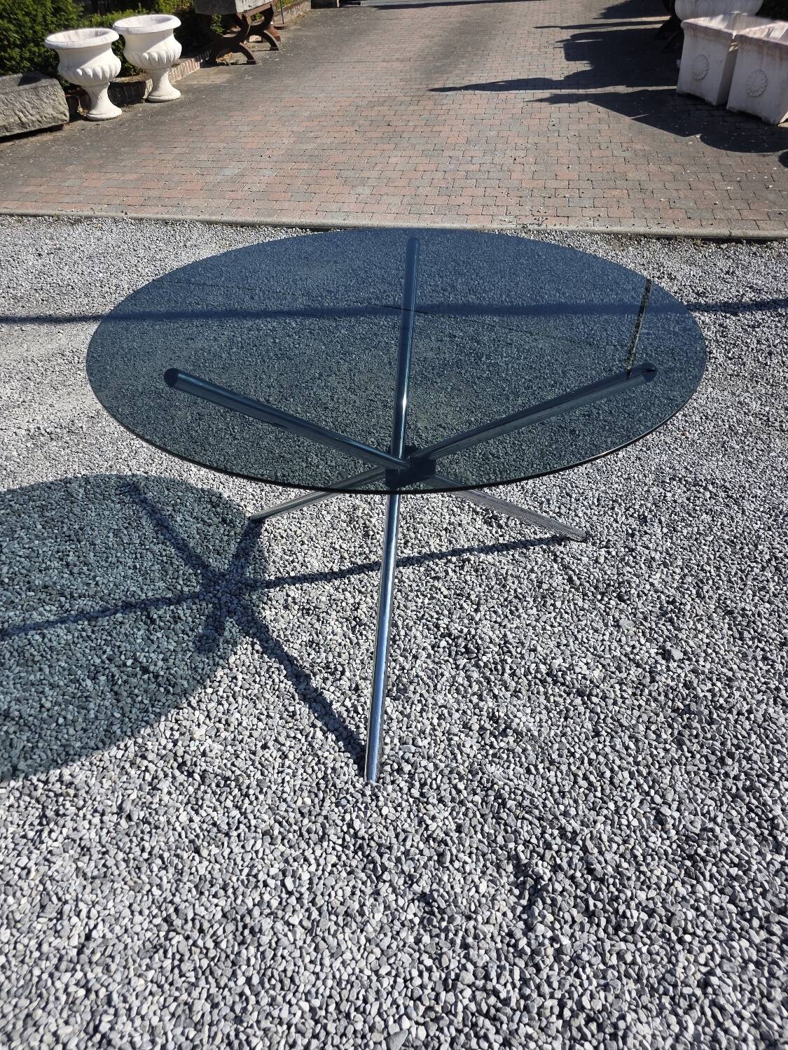 Round chrome metal table with smoked glass top from the 70s