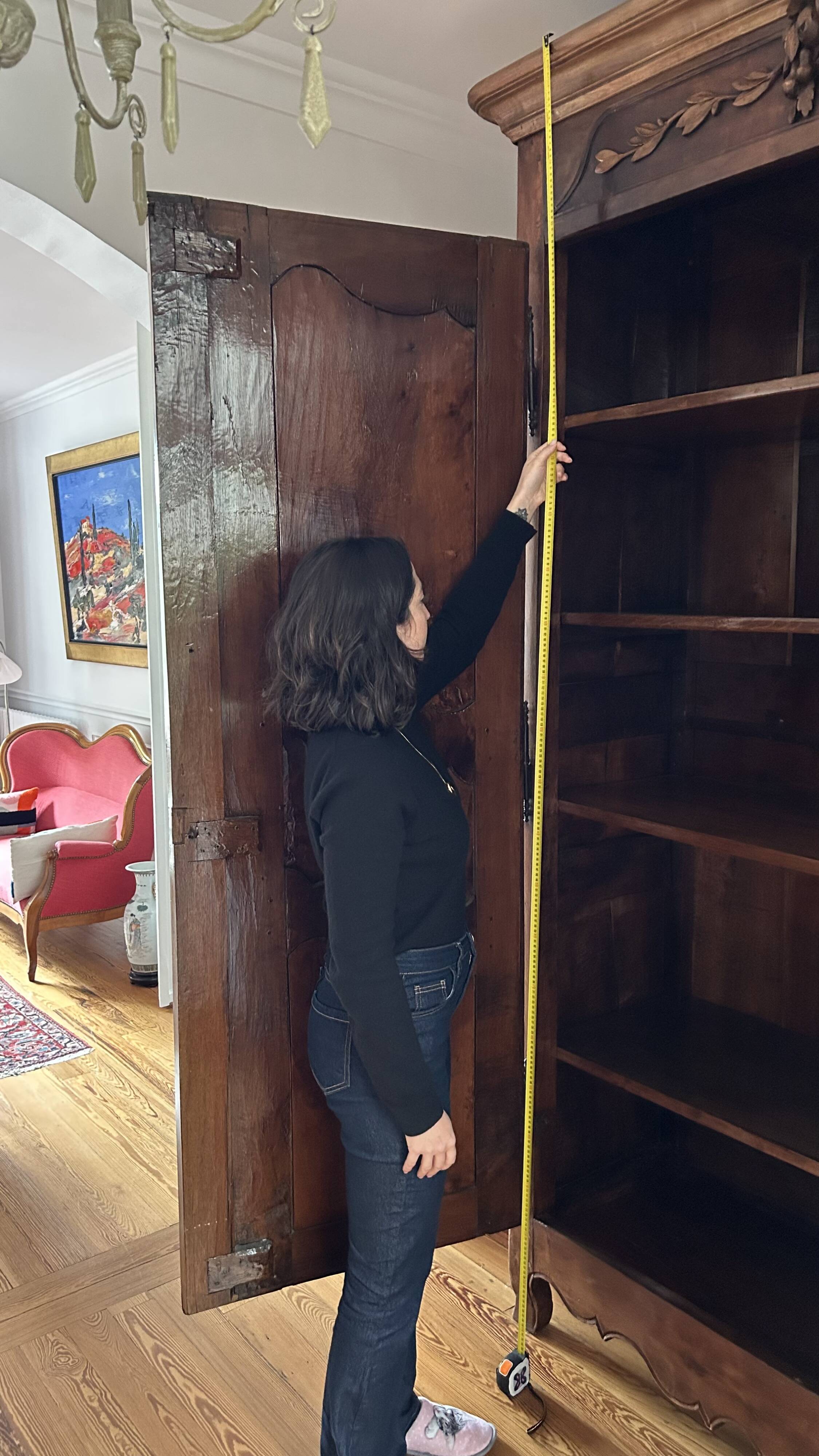 Antique walnut armoire with two doors.