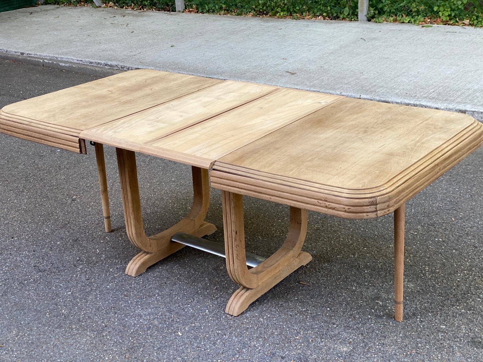 Art Deco dining table with a central pedestal, stripped in solid oak, with 2 extensions.