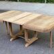 Art Deco dining table with a central pedestal, stripped in solid oak, with 2 extensions.