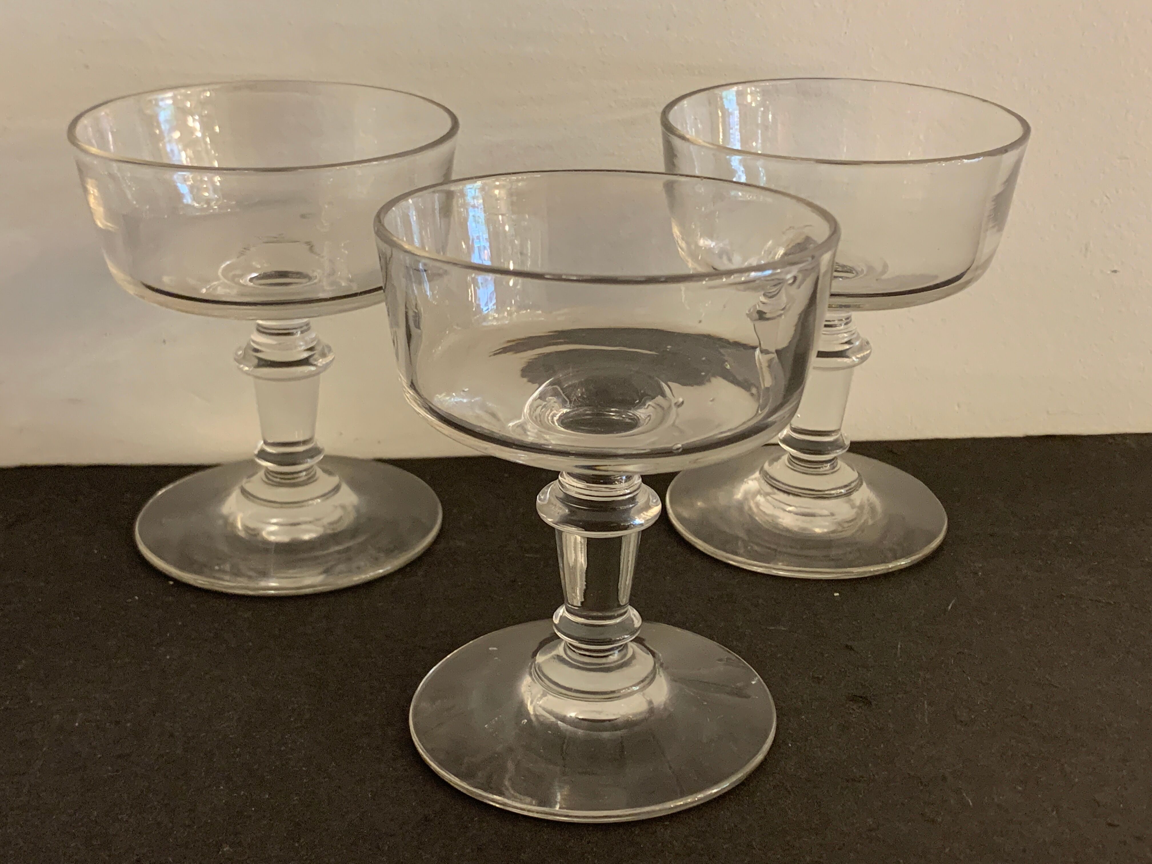 3 old champagne cups in blown and bubbled glass