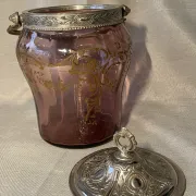 Purple glass biscuit barrel with painted gold arabesque decorations for cakes.