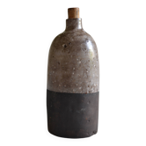 Ceramic bottle vase with a fish signature to be identified.