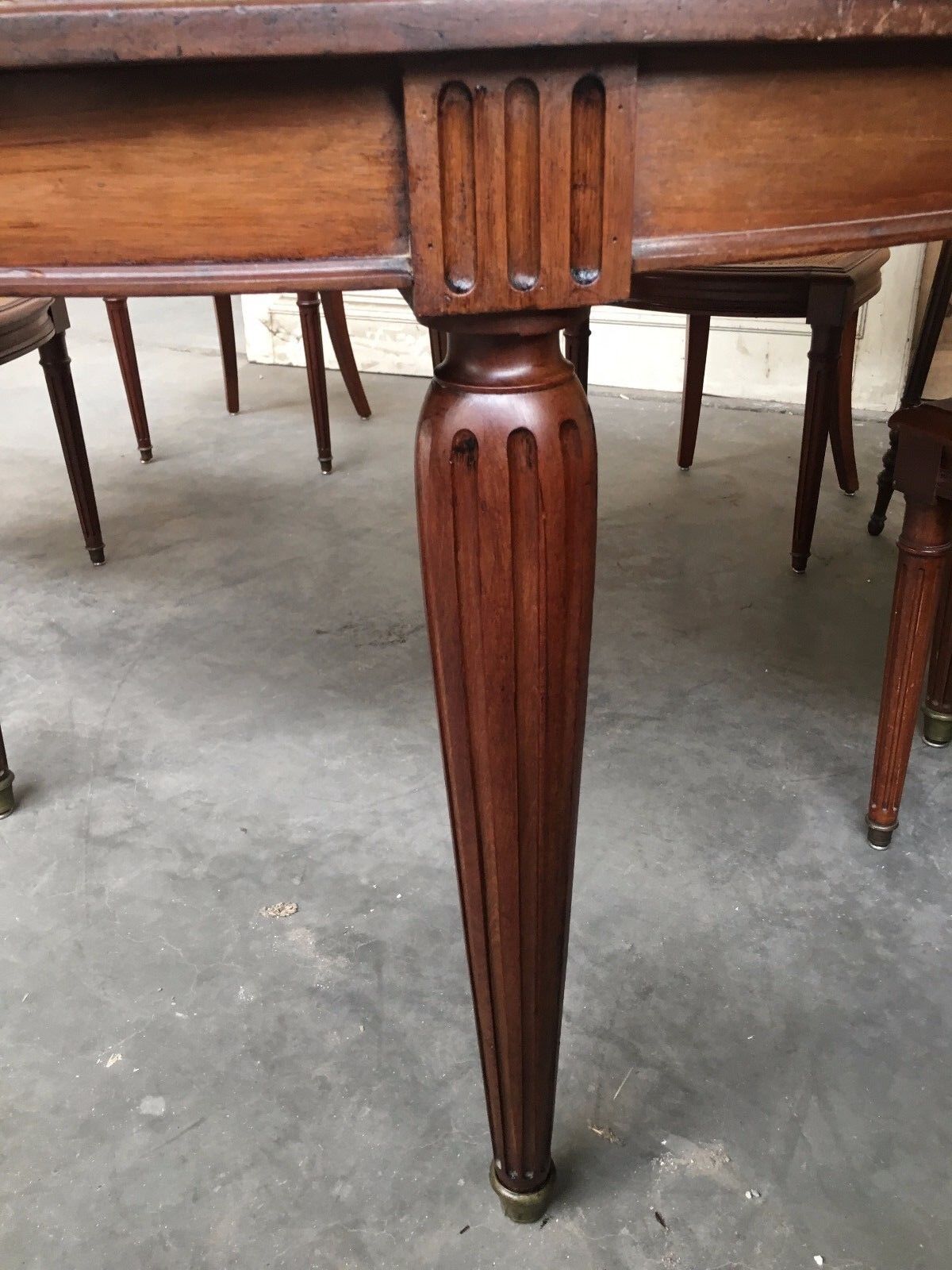 Table and six chairs in the Louis XVI style mahogany