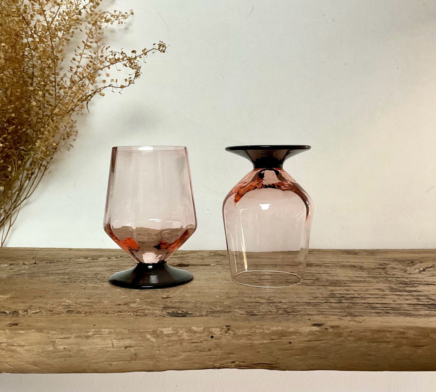 6 small pink glasses with black stems