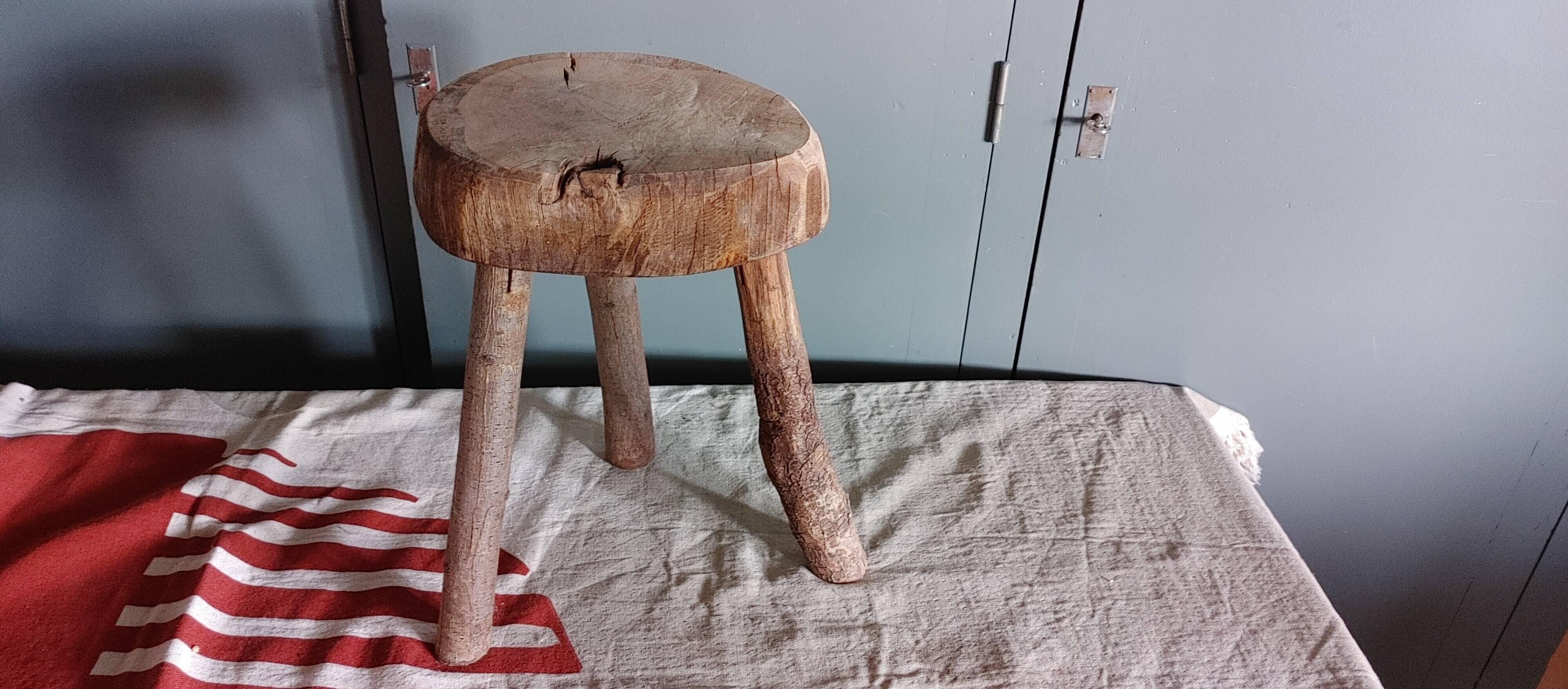 Old small country stool in raw wood - tripod base