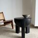 Black mango wood tripod side table with a semi-spherical top, height: 45 cm, diameter: 44 cm.